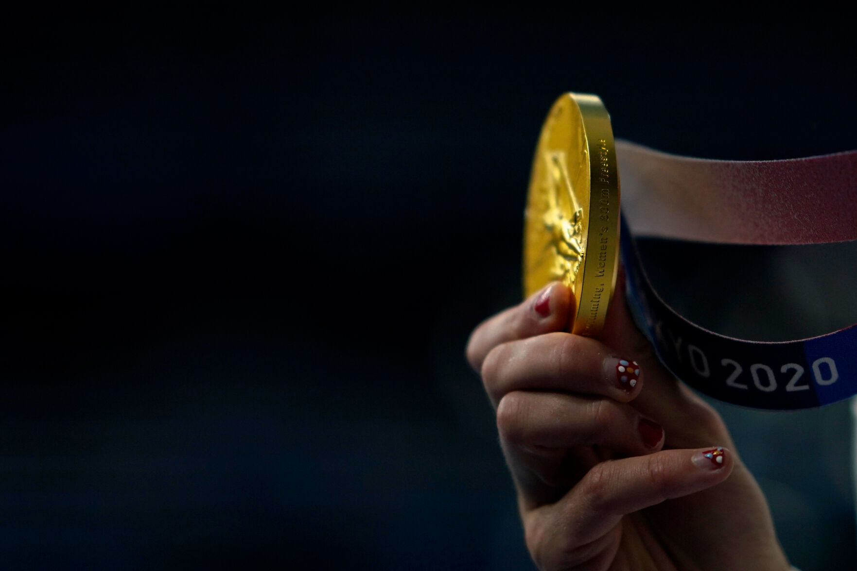 Katie Ledecky shows her gold medal